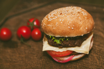 cheeseburger with pork on a wooden board