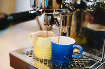 fresh coffee pouring through a bottomless portafilter 