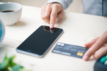 Mobile payments.Hands using smartphone and credit card for online shopping, m-banking.
