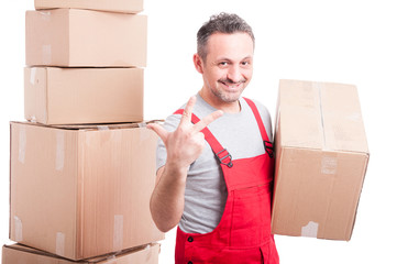 Portrait of mover guy holding box showing three gesture