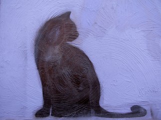 Black cat painted on a purple wall