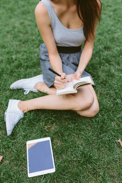 Young Girl Writing Her Toughts in a Diary