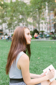 Young Girl Writing Her Toughts in a Diary