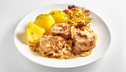 Pork fillet pieces with potatoes