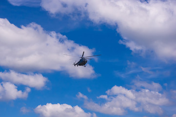 helicopter in the blue sky