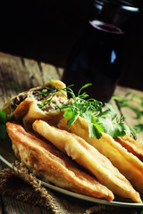 Fried chebureks, meat pies, rustic style, selective focus