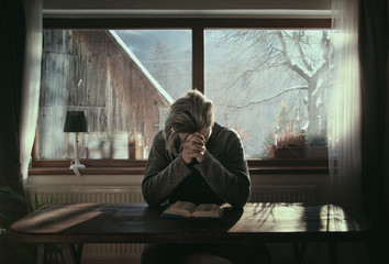 Man Praying with Big Window Background