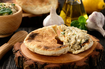 Traditional greek eggplant spread (dip) with pita bread.