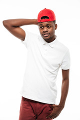 Cheerful young african man wearing cap looking at camera.