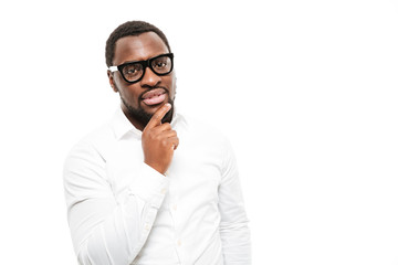 Serious young african man standing isolated over white background.