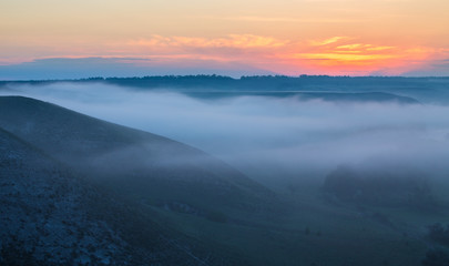 landscape of dense fog in the field at sunrise