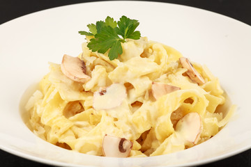 Pasta with white sauce and mushrooms