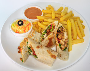 Chicken shawarma with coleslaw, sauce and french fries