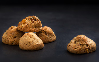 Raisins cookies on a black background