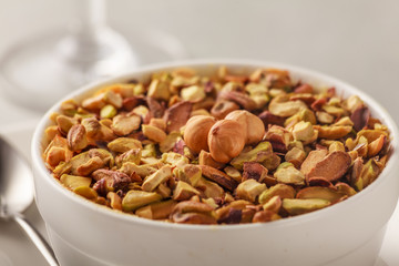 Pistachio and  hazelnuts on a bowl