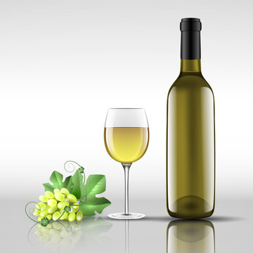bottle of white wine with glass