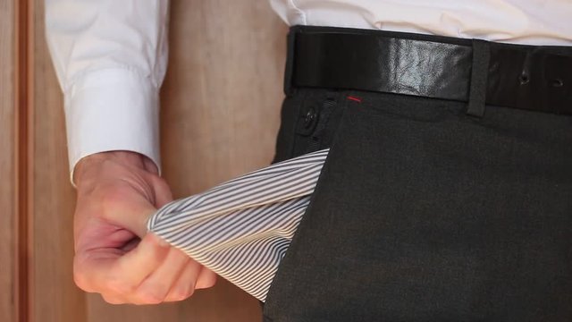 Businessman shows his empty pocket
