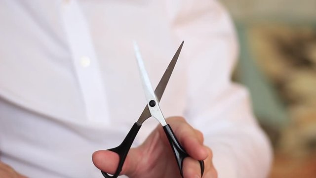 Man with scissors in his hand