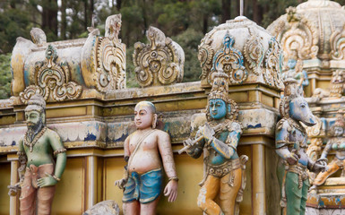 Fototapeta na wymiar hindu statues relief on temple facade