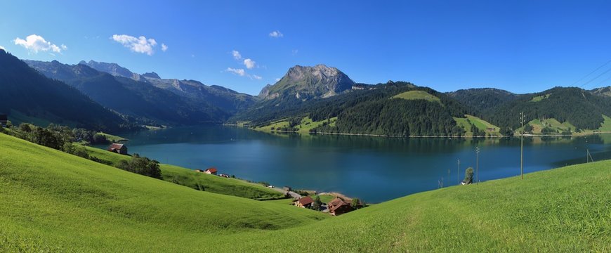 Lake Wagital in summer. Green meadow and mount Fluebrig.