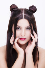 Fototapeta premium Young happy beautiful woman with bright makeup hairstyle with horns on a white background