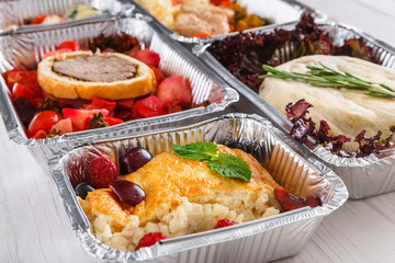 Healthy food take away, top view at wood background