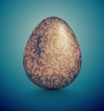 Glossy realistic golden egg with blue ink handdrawn floral pattern. Isolated on turquoise background. Vintage banner, card, poster for Easter, business benefit concept