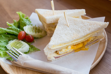 slice ham cheese egg sandwich breakfast with fresh vegetable