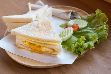 slice ham cheese egg sandwich breakfast with fresh vegetable