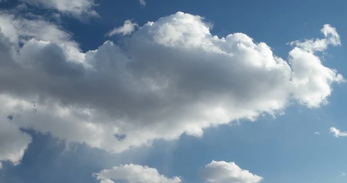 white clouds running on blue sky