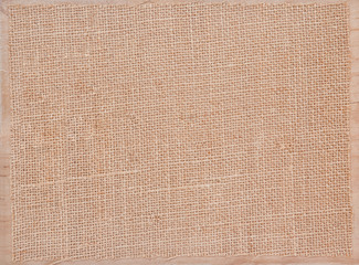 Fototapeta na wymiar Linen fabric texture grunge on wooden board