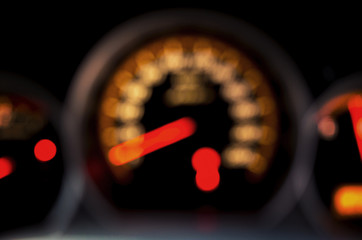 Blurred Speed Gauge in car. Abstract background.
