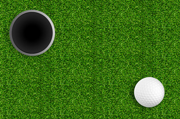 golf ball and hole on the green grass of the golf course