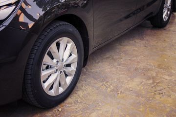 Alloy wheel of luxury car in view side.