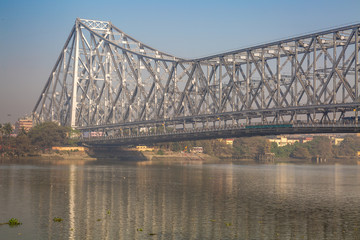 Fototapeta premium Howrah Bridge - The Cantilever bridge on river Hooghly at Kolkata, India in close up.
