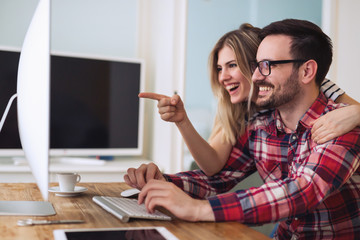 Creative man working from home with wife