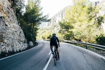  Cyclist on a mountain road © onewithahalf