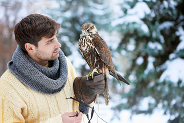 man holding a falcon