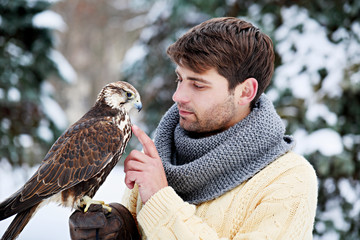 man holding a falcon