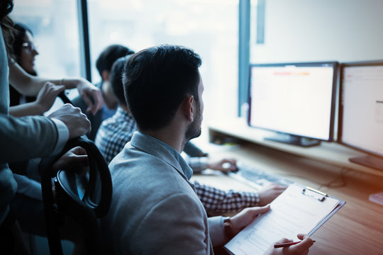IT colleagues working on software developement project
