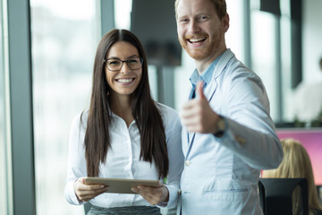 Happy and confident colleagues looking for you