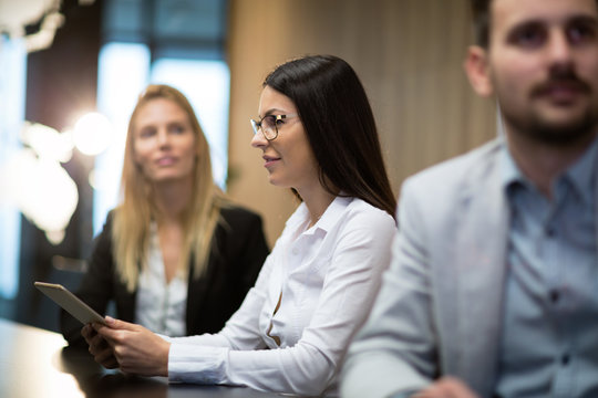 Business people sitting at table