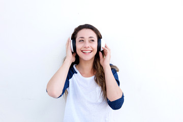 happy young woman listening to music with headphones