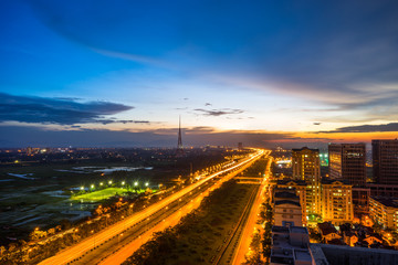 Fototapeta na wymiar Hanoi cityscape at Thang Long multiple land highway at night.