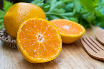 sliced oranges on wooden table