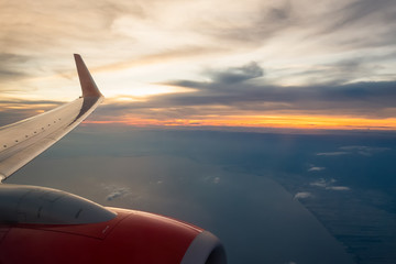 Fototapeta na wymiar View of ocean with airplane wing