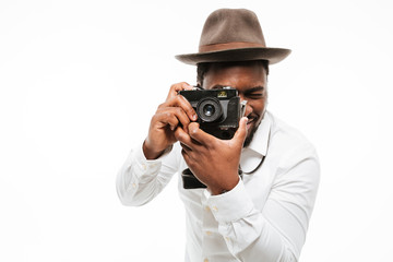 Happy young african photographer dressed in shirt