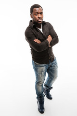 Handsome young african man dressed in shirt with arms crossed