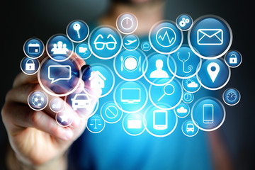 Concept of multimedia icon flying over device on a technology interface - Internet concept