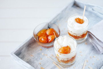 Oats layered with spicy apricot jam. Healthy food concept.